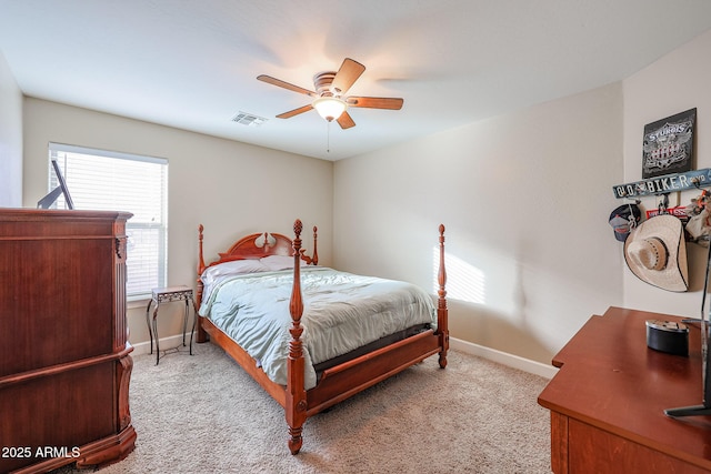 bedroom with ceiling fan and light carpet