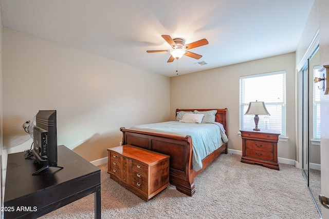 bedroom with light colored carpet and ceiling fan