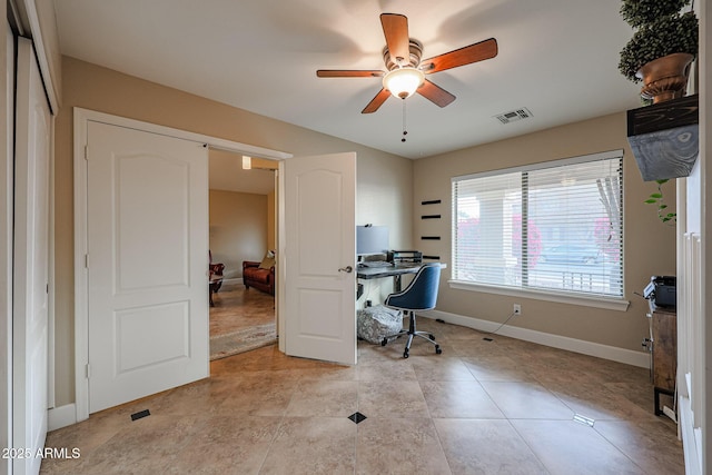 office space with ceiling fan