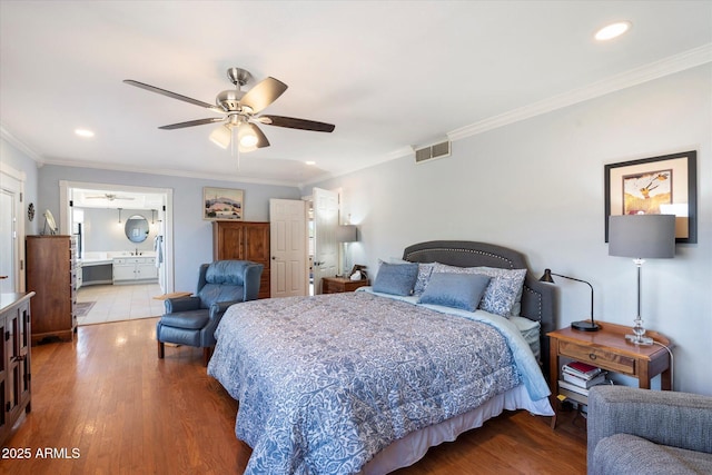 bedroom with recessed lighting, ornamental molding, and wood finished floors