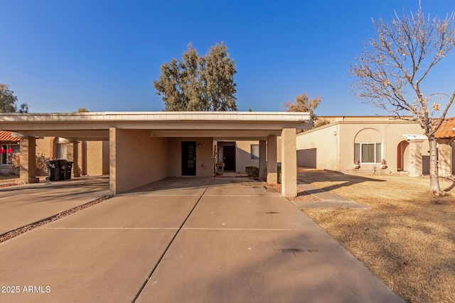 exterior space with a carport