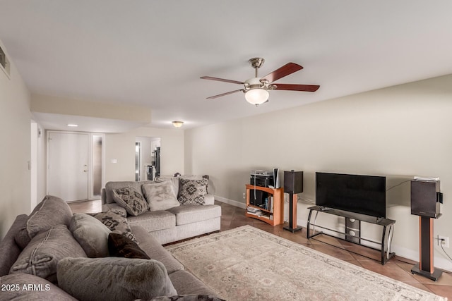 tiled living room featuring ceiling fan