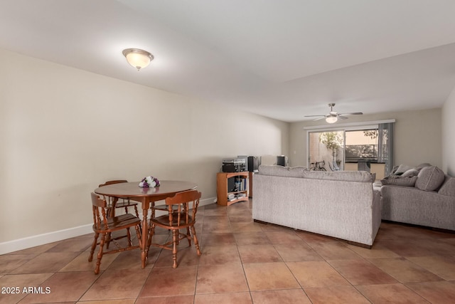 living room featuring tile patterned flooring and ceiling fan