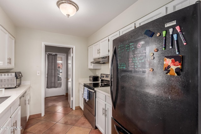 kitchen featuring white cabinetry, appliances with stainless steel finishes, and light tile patterned floors