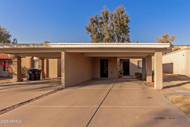 view of front of property featuring a carport