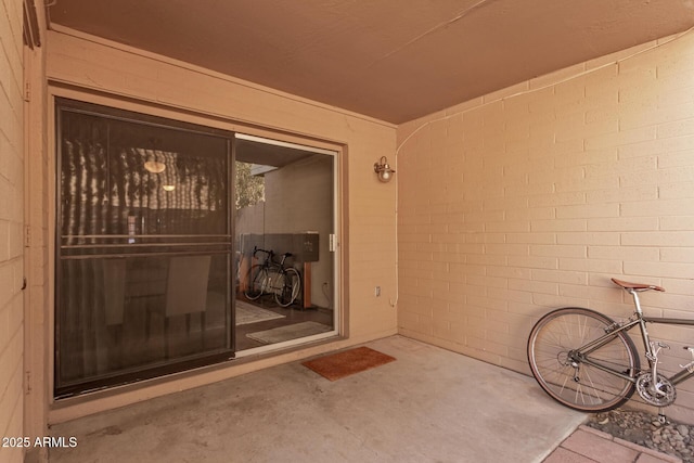 view of exterior entry featuring a patio area