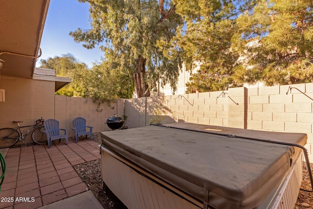 view of patio / terrace featuring a hot tub