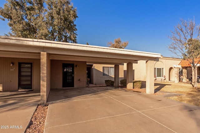 exterior space featuring a carport