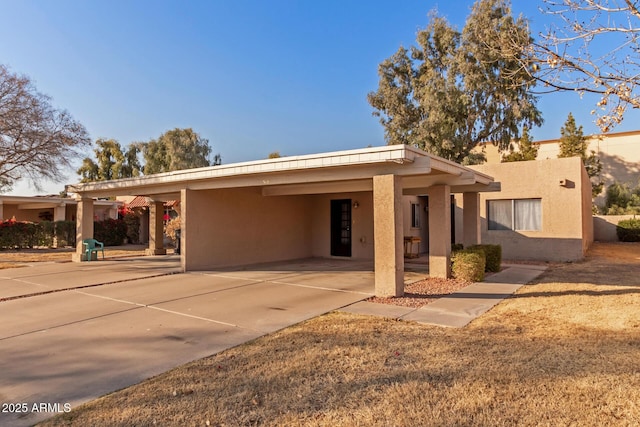 view of front of property featuring a carport