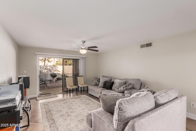 living room with light tile patterned flooring and ceiling fan