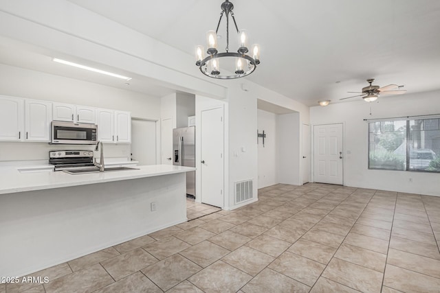 kitchen featuring visible vents, white cabinets, a sink, light countertops, and appliances with stainless steel finishes
