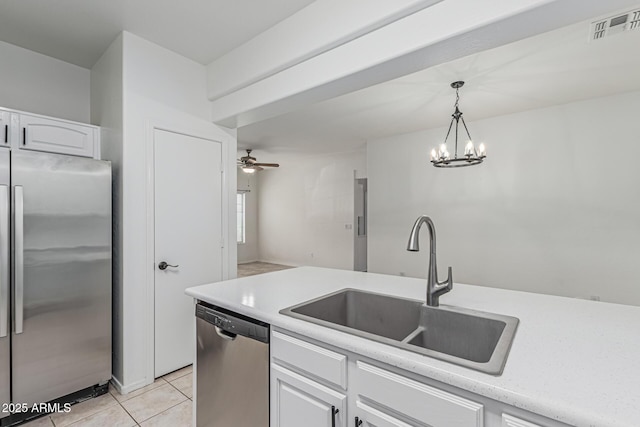 kitchen featuring visible vents, light tile patterned floors, a sink, light countertops, and appliances with stainless steel finishes