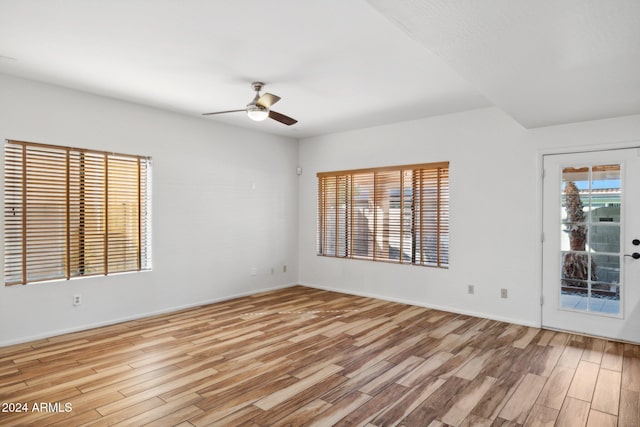 spare room featuring ceiling fan and light hardwood / wood-style flooring