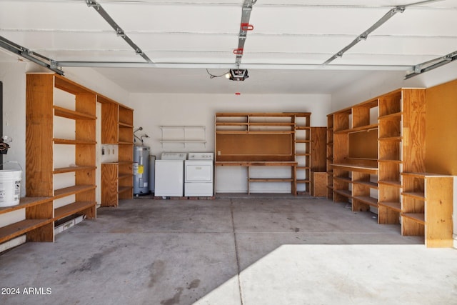 garage featuring washing machine and clothes dryer, electric water heater, and a garage door opener