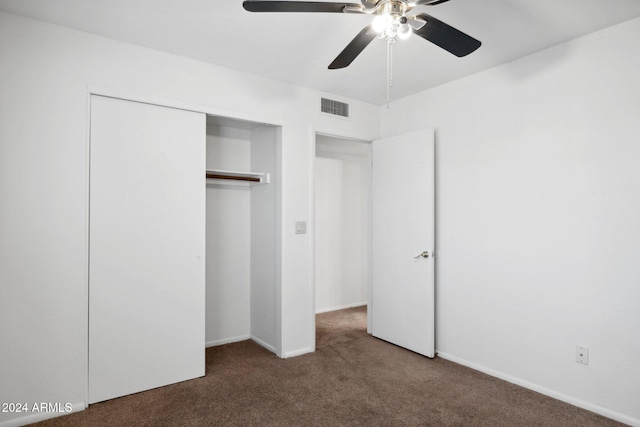 unfurnished bedroom featuring ceiling fan, a closet, and carpet floors