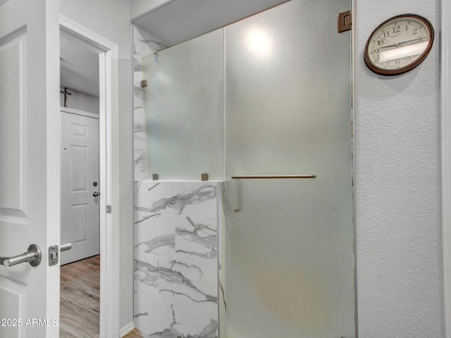 bathroom with wood-type flooring