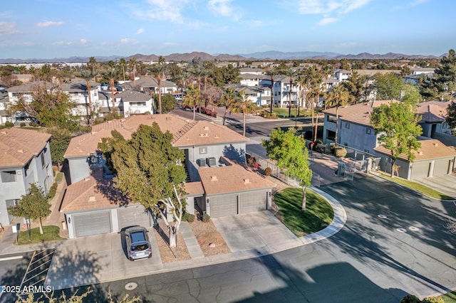 birds eye view of property featuring a mountain view