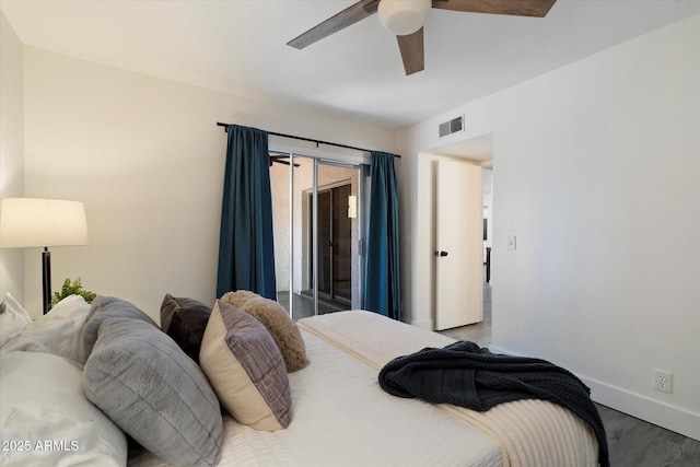 1120 E Beryl Ave, Phoenix, AZ 85020 - bedroom with access to exterior, wood finished floors, and ceiling fan