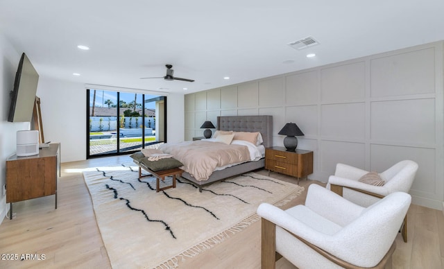 bedroom with access to outside, ceiling fan, and light hardwood / wood-style flooring