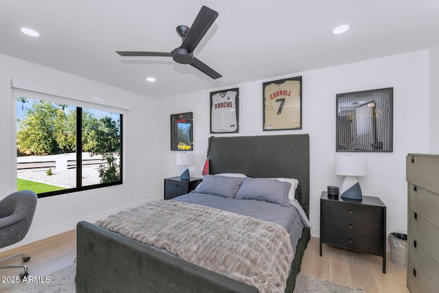 bedroom featuring ceiling fan and light hardwood / wood-style flooring