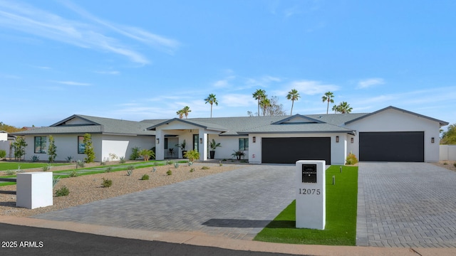 ranch-style house featuring a garage