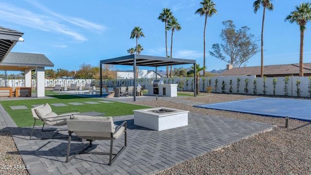 view of patio / terrace featuring an outdoor fire pit