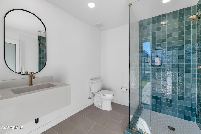 bathroom with sink, tile patterned floors, toilet, and an enclosed shower