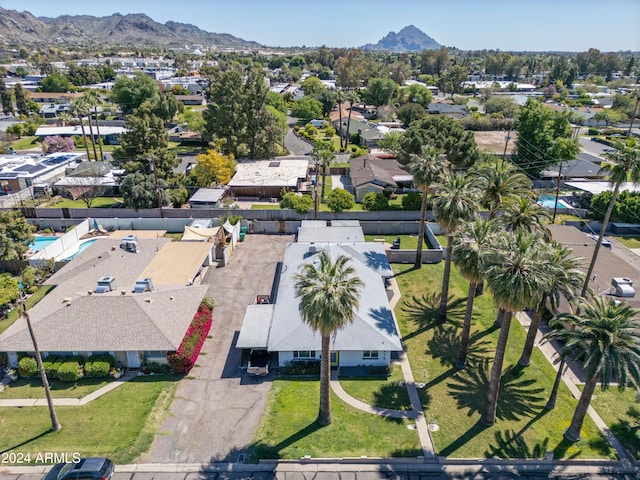 birds eye view of property with a mountain view