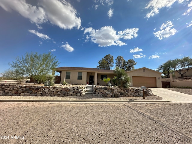 ranch-style home with a garage