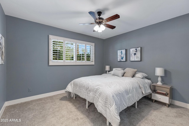 bedroom with carpet, a ceiling fan, and baseboards