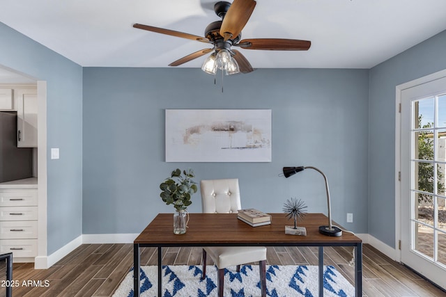 office featuring baseboards, a ceiling fan, and wood finish floors