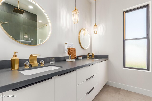 bathroom featuring vanity, tile patterned floors, and walk in shower