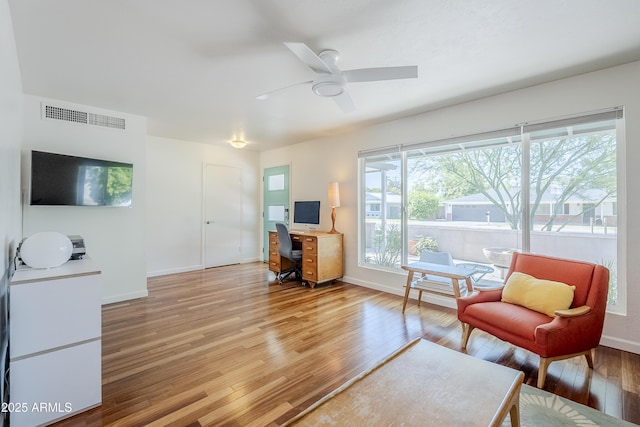 314 E Royal Palm Rd, Phoenix, AZ 85020 - living room featuring a desk, light wood-style floors, and a ceiling fan