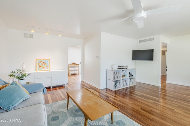 314 E Royal Palm Rd, Phoenix, AZ 85020 - living area featuring track lighting, wood finished floors, and a ceiling fan