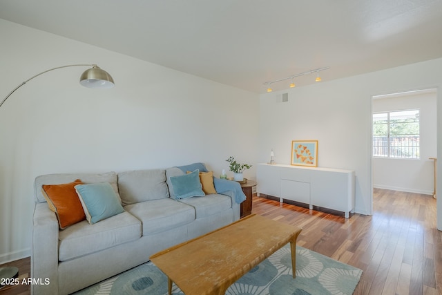 314 E Royal Palm Rd, Phoenix, AZ 85020 - living room with rail lighting and wood finished floors