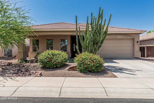 12417 W Apache St, Avondale, AZ 85323 - view of front of house with stucco siding, a garage, concrete driveway, and a tile roof