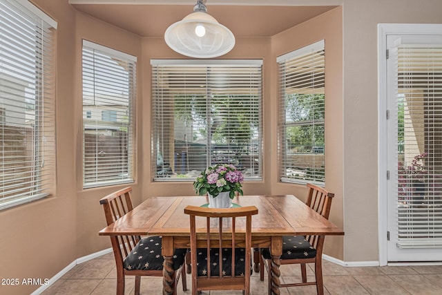 12417 W Apache St, Avondale, AZ 85323 - dining space with baseboards and light tile patterned floors