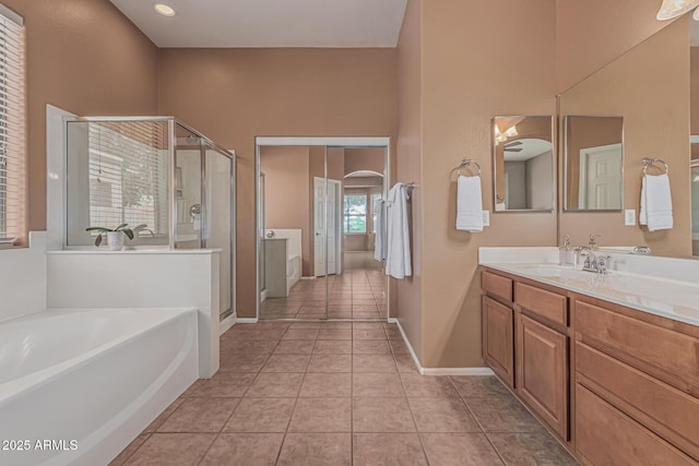 12417 W Apache St, Avondale, AZ 85323 - full bath with a shower stall, a bath, vanity, tile patterned flooring, and baseboards