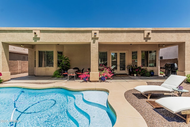 12417 W Apache St, Avondale, AZ 85323 - swimming pool with french doors, a patio, and a grill
