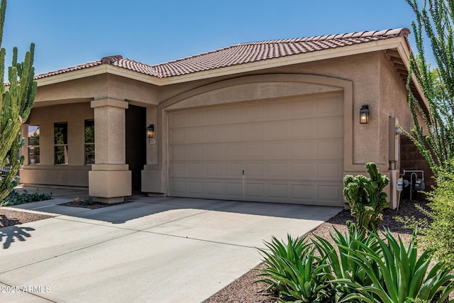 12417 W Apache St, Avondale, AZ 85323 - view of front of home featuring stucco siding, concrete driveway, a garage, and a tile roof