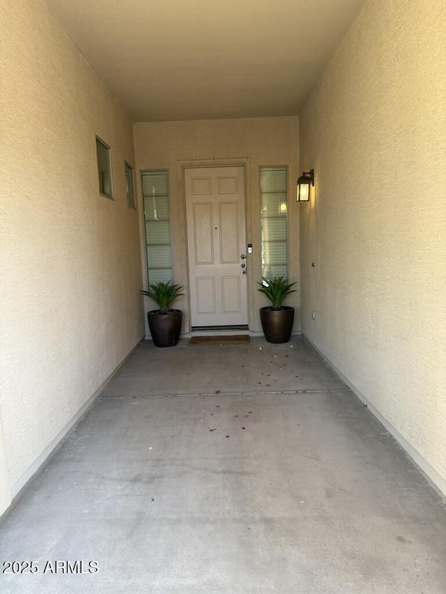 12417 W Apache St, Avondale, AZ 85323 - doorway to property featuring stucco siding