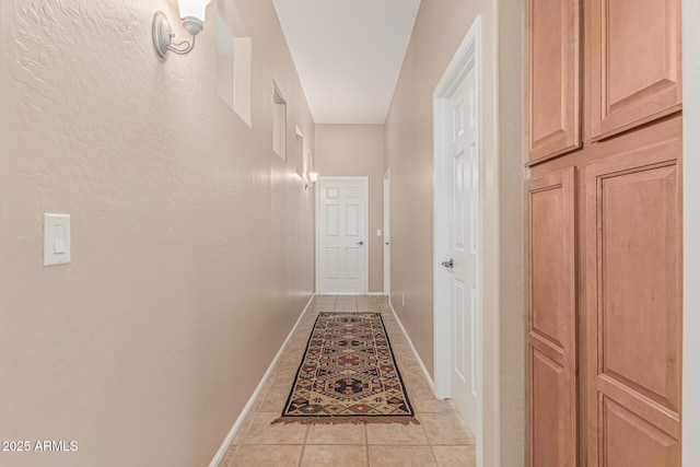 12417 W Apache St, Avondale, AZ 85323 - corridor featuring light tile patterned floors and baseboards