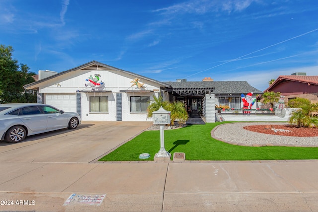 view of front facade with a front lawn and a garage