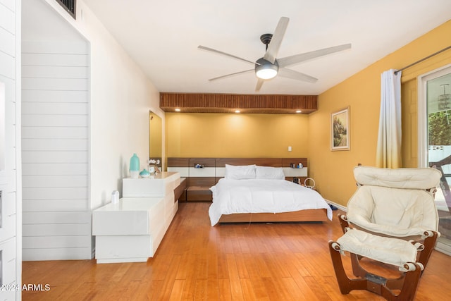 bedroom with light wood-type flooring and ceiling fan