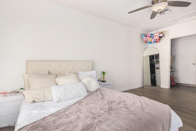 bedroom featuring ceiling fan and dark wood-type flooring