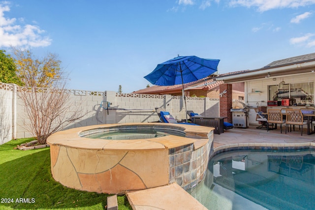 view of pool featuring an in ground hot tub and grilling area