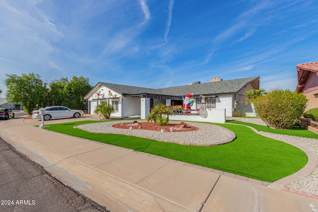 ranch-style home with a front yard