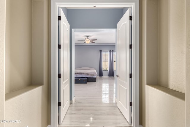 hall with light hardwood / wood-style floors