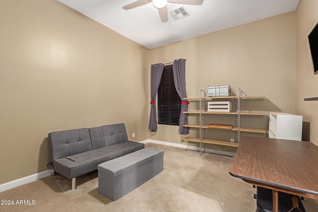 interior space with ceiling fan and light colored carpet