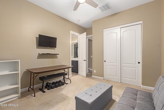 living room with ceiling fan and light colored carpet